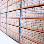 Rows of shelves of archive boxes in a warehouse